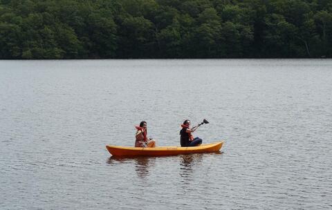 Two women canoeing on a lake